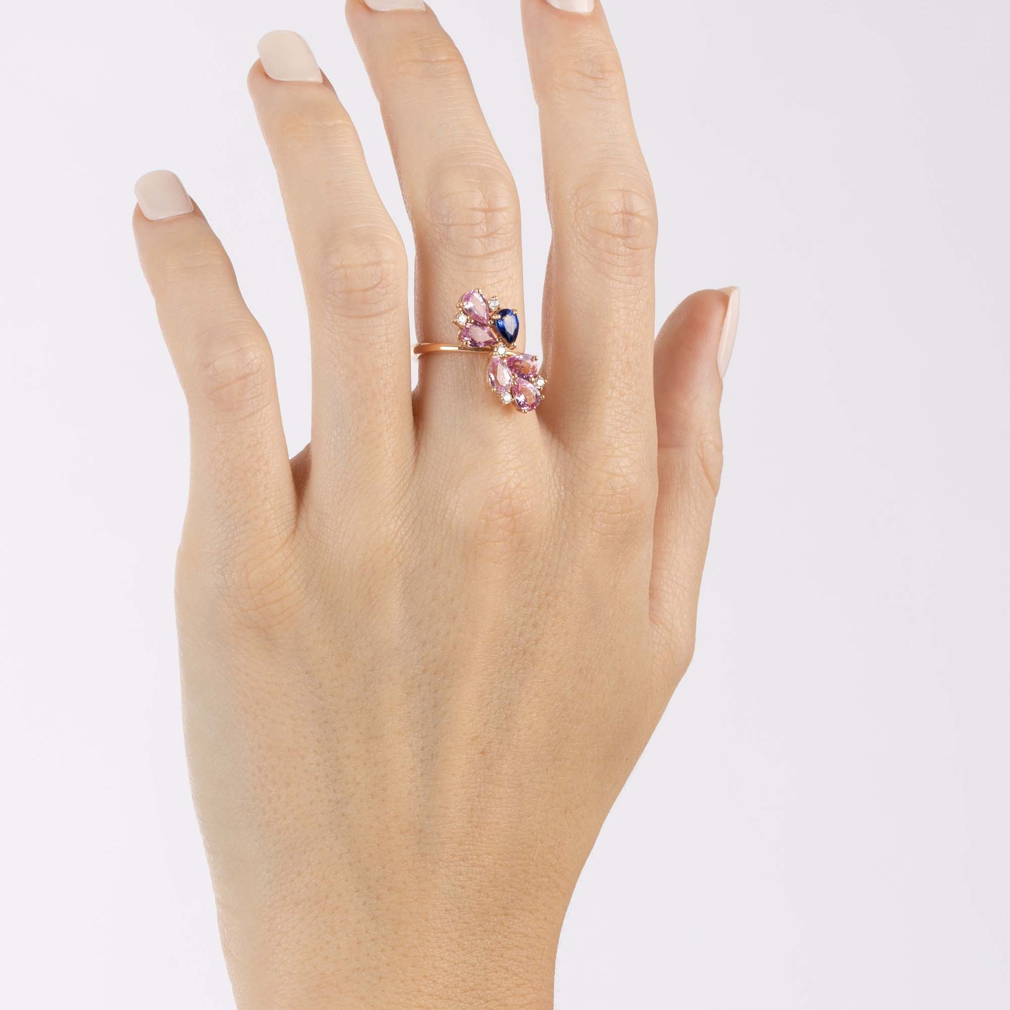 Rose Gold Ring with Pink Sapphires and a Blue Sapphire, and small round Diamonds - Model shot