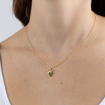 Yellow Gold Necklace with a pear shaped Peridot and small round Diamonds, Small - Model shot