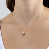 Yellow Gold Necklace with a pear shaped Peridot and small round Diamonds, Small - Model shot