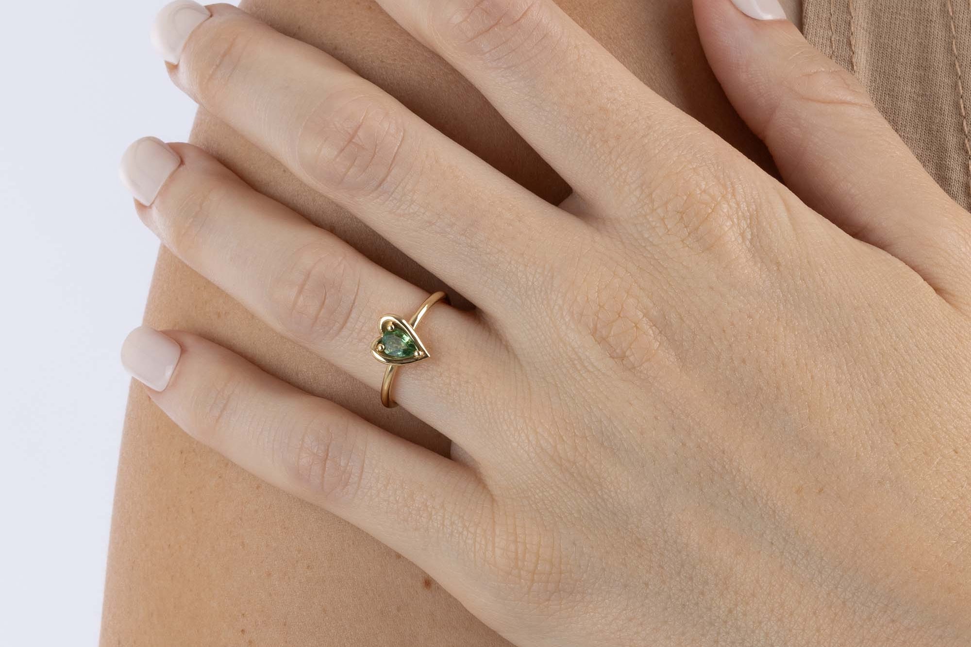 Yellow Gold heart shaped ring with a pear shaped Green Sapphire, Small - Model shot