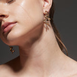 Earrings with Yellow Gold ribbon swirled around rod of Diamonds, Large - Model shot