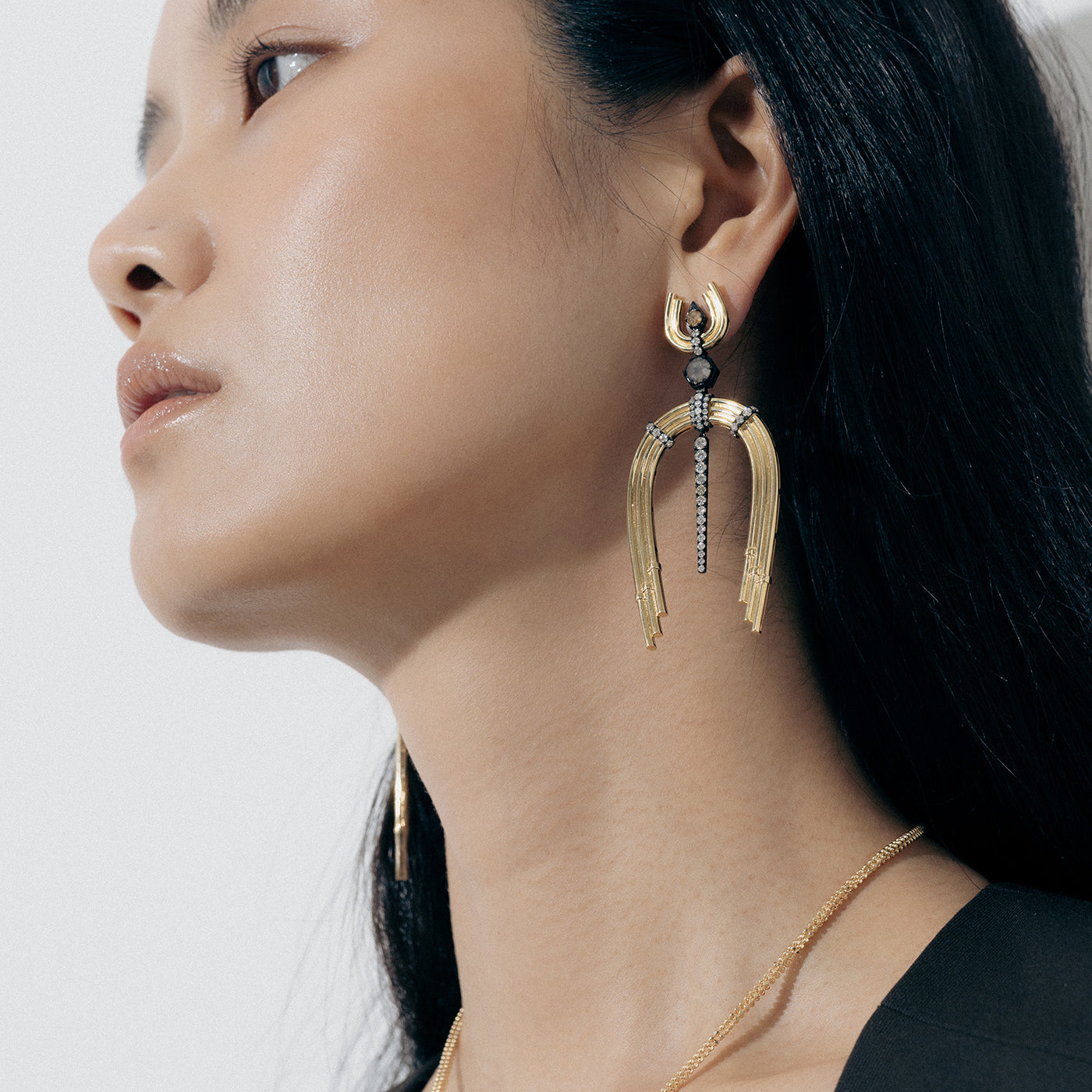 Yellow Gold Earrings with Diamond-lined, Rhodium plated features and horseshoe shapes - Model shot