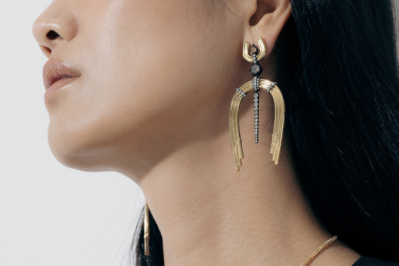 Yellow Gold Earrings with Diamond-lined, Rhodium plated features and horseshoe shapes - Model shot