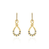 Yellow Gold Earrings forming an uneven figure 8, with Rhodium Plated notches and Diamonds, Medium