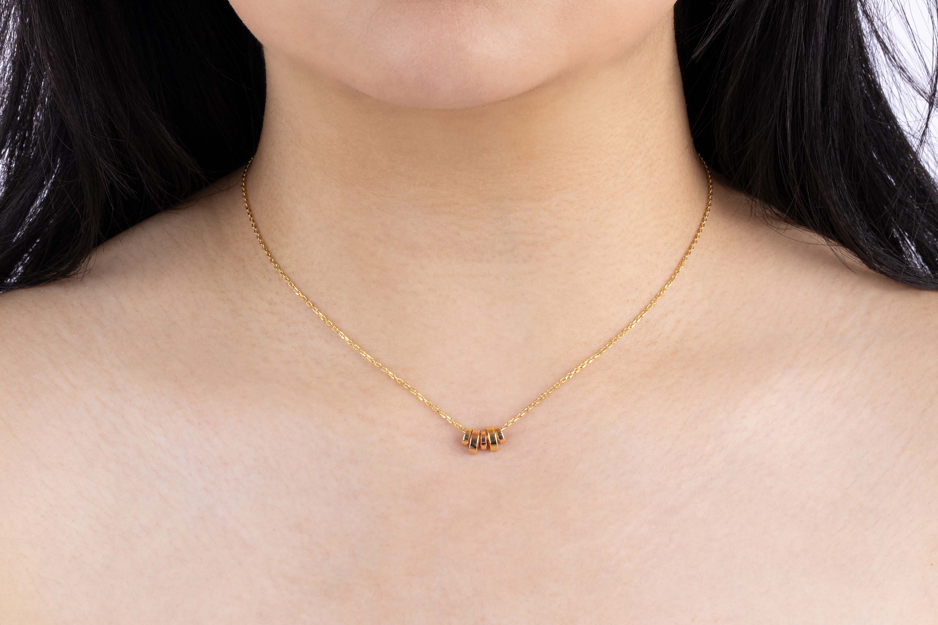 Yellow Gold Necklace with five alternating Yellow and Rose Gold discs, Small - Model shot